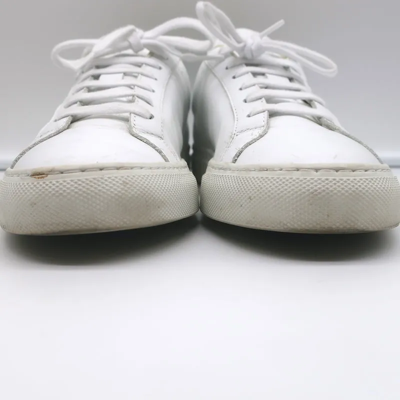 Baskets basses rétro Woman par Common Projects en cuir blanc et vert taille 37