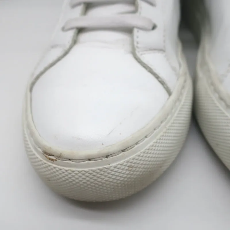 Baskets basses rétro Woman par Common Projects en cuir blanc et vert taille 37